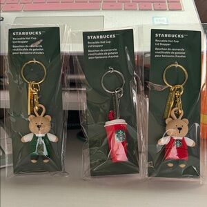 Starbucks Holiday 2025 Bearista Bear Reusable Hot Cup Lid Stopper keychain set.